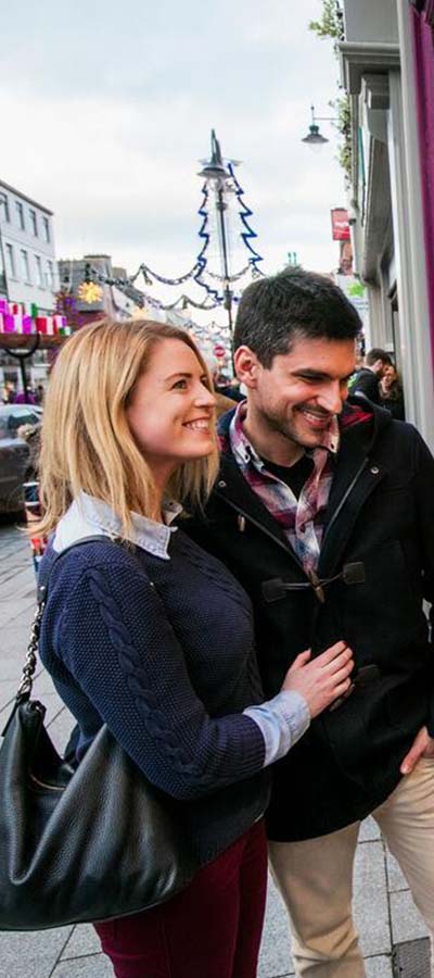 Couple window shopping in Killarney