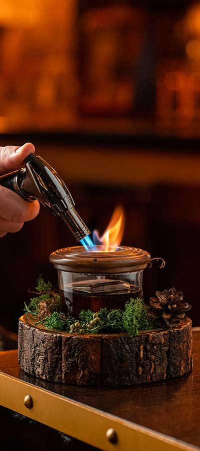 Smoking a cocktail at Pigs Lane